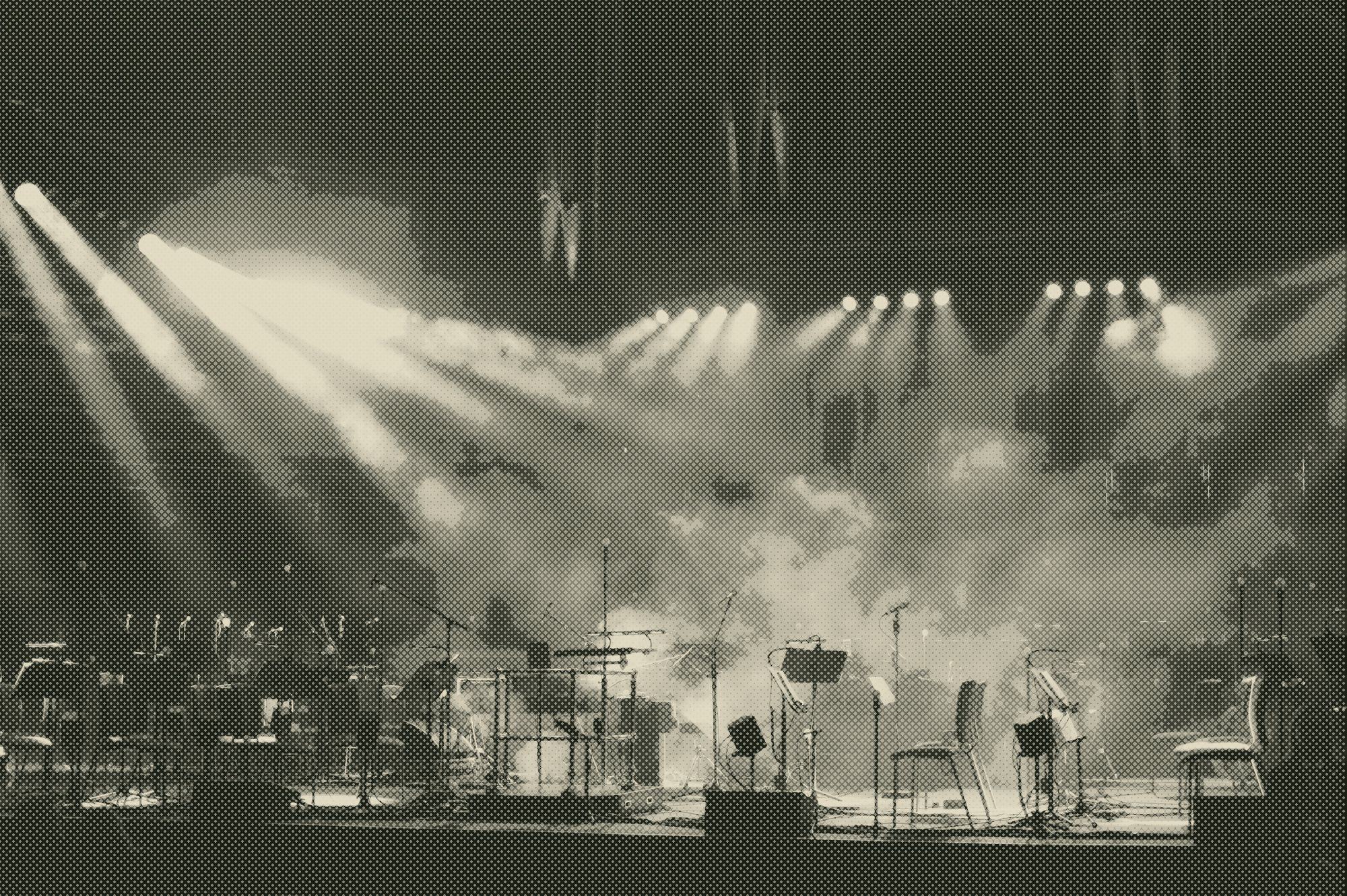 stage lights and smoke in a concert hall