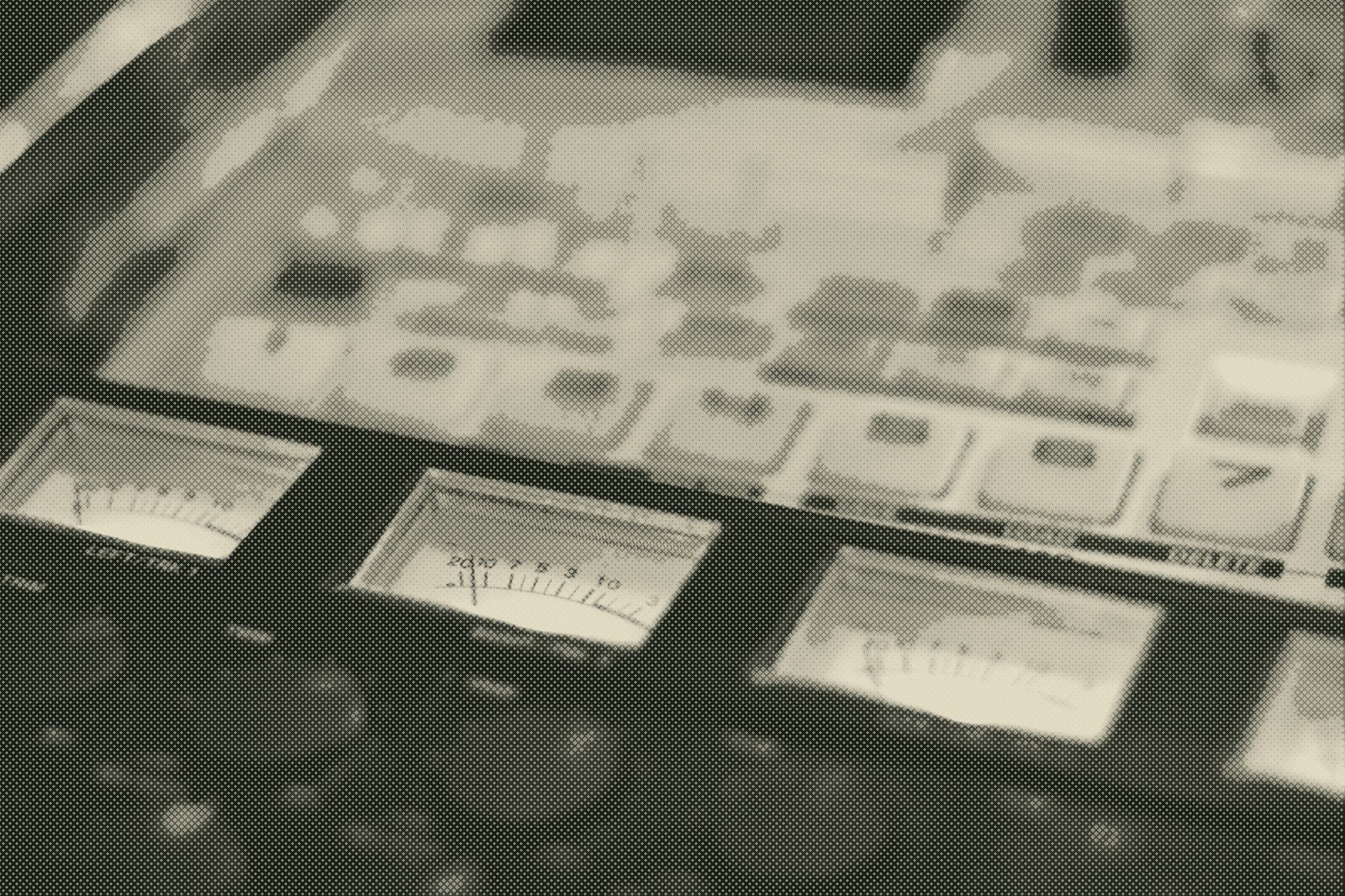 glowing vu meters on a piece of audio equipment